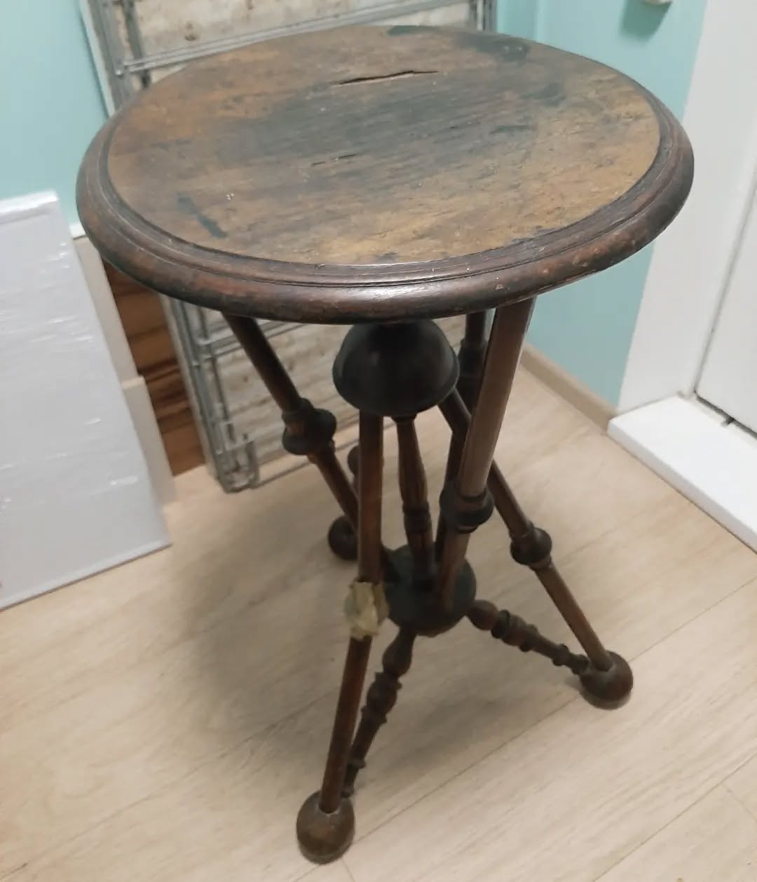 Tabletop with severe water damage and worn finish