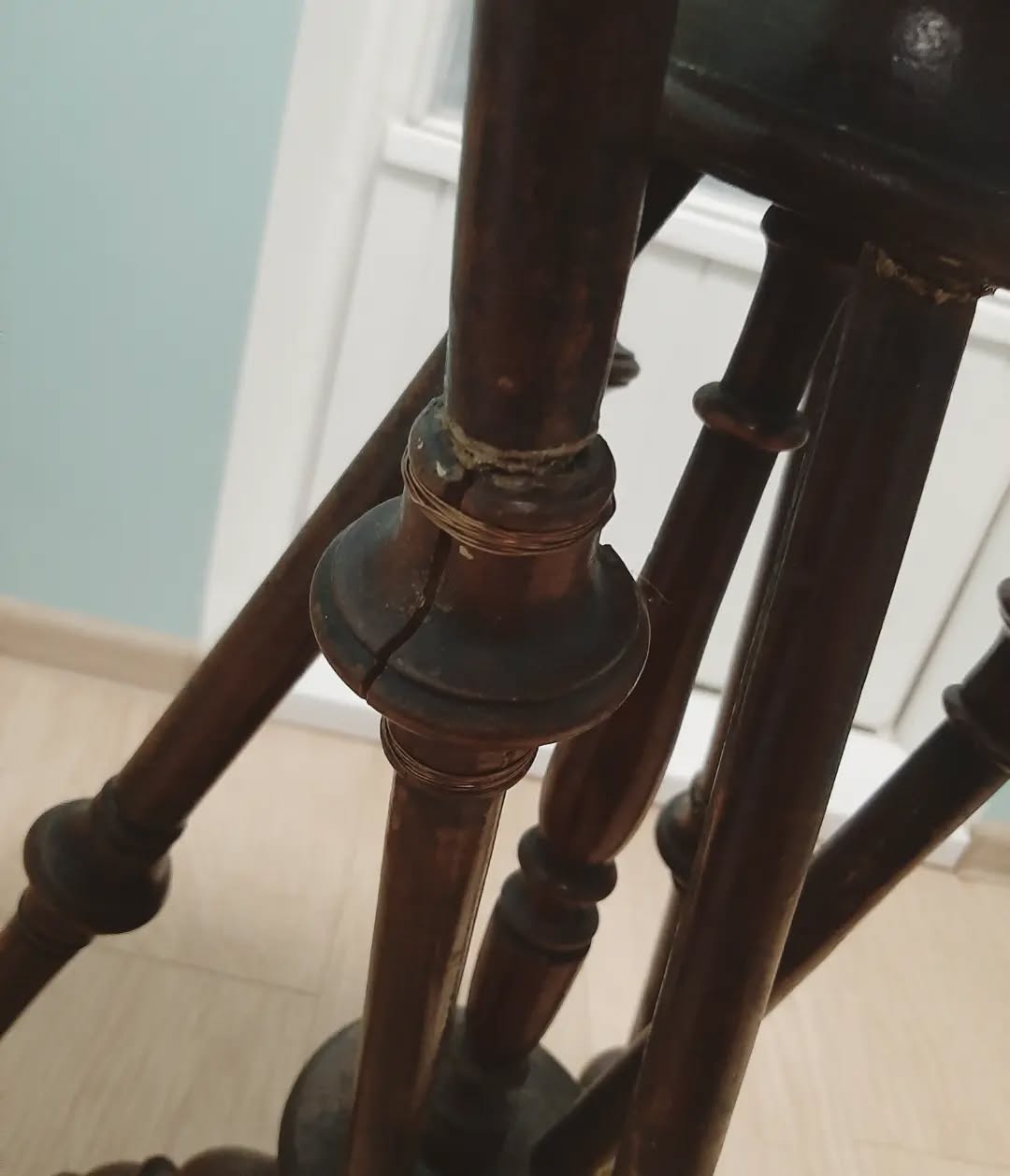 Broken wooden table legs with bug damage